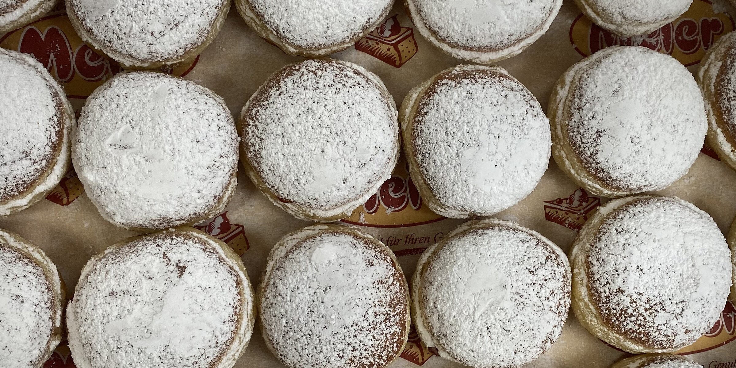 A full box of donuts.