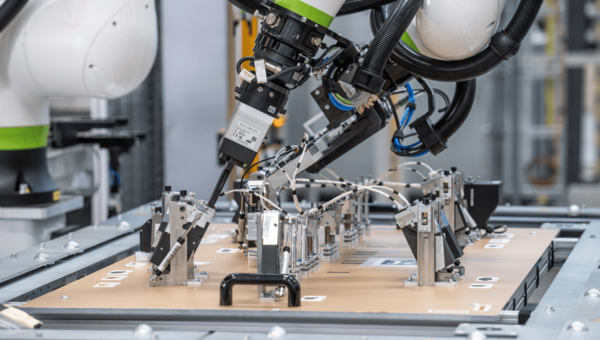 Robotic arm working on a wiring harness