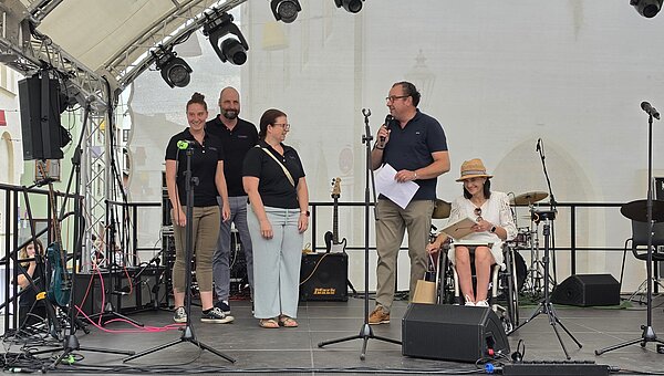 Kroschu employees on stage during the awards ceremony.
