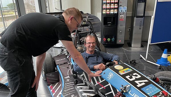 Kroschu employee in the Formula Student racing car.