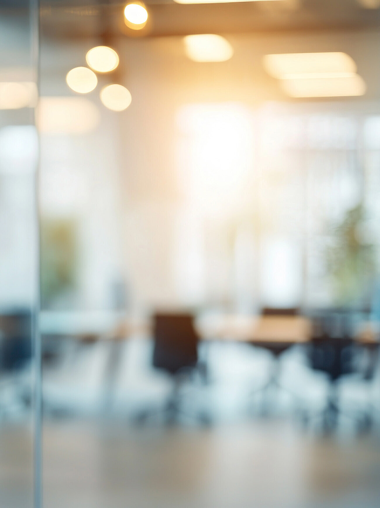 Heavily blurred view of a meeting room with recognizable chairs